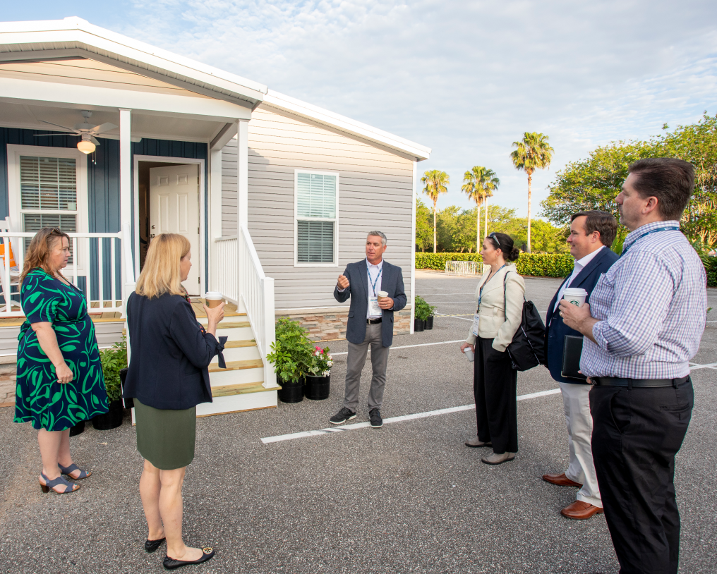 Group speaking outside house Group speaking outside house